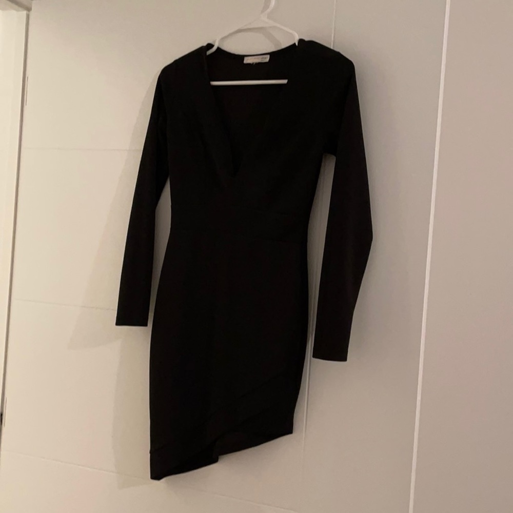 A symmetrical black dress